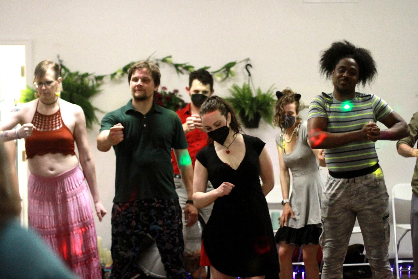 Dancers gathered on the floor at a social
